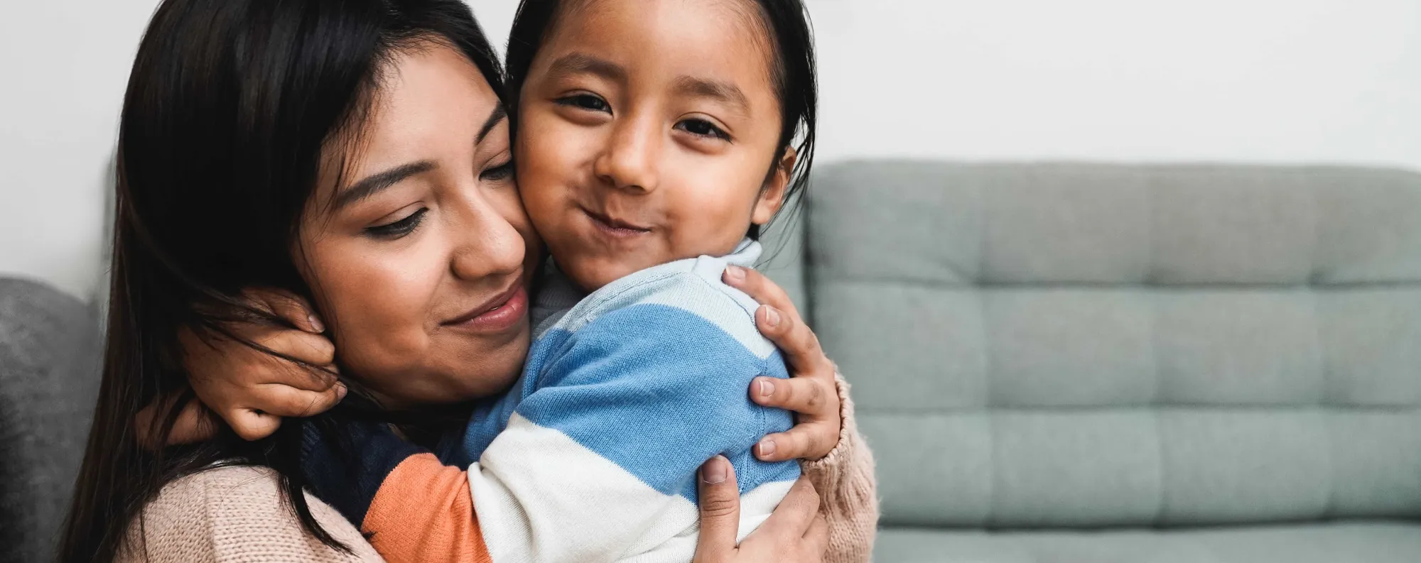 Woman holding child.